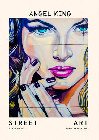 Colorful street art poster of a woman's face with bright blue eyes and pink lips, titled "Angel King no.2".