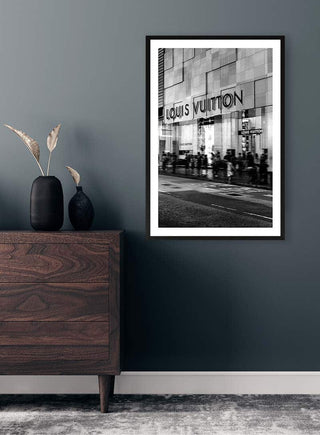 Black and white photo of a Louis Vuitton storefront displayed in a modern, stylish living room.