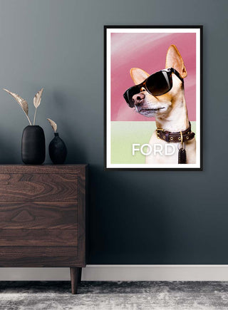 Framed "Cool as Ford Pink" print featuring a dog with sunglasses, hanging on a dark wall above a dresser.