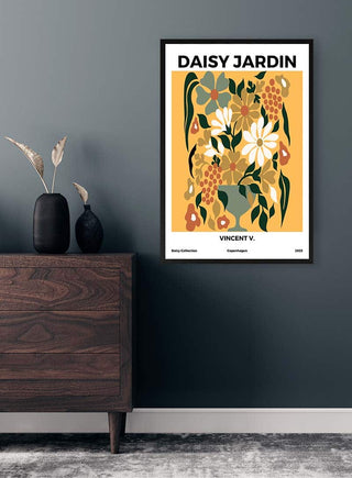 Framed "Daisy Jardin No 2 - Vincent V." art poster with abstract floral design hanging on a dark wall above a dresser.