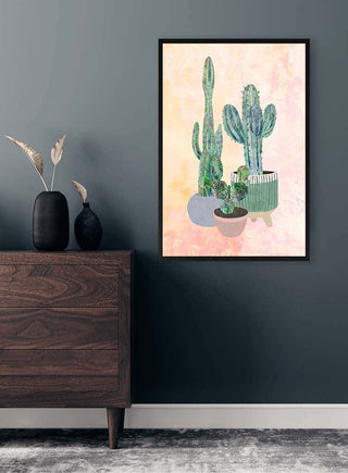 Framed Boho Cactus wall art above a wooden dresser in a modern room with minimalist decor.