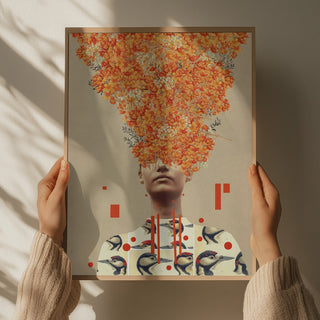 Person holding "Bird Flight In Autumn" print by Frank Moth, featuring fall leaves and birds in a surreal composition.