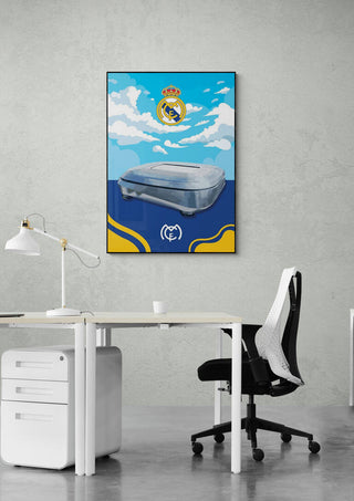 Santiago Bernabeu Real Madrid poster on a wall above a modern white desk and chair in an office setting.