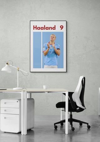 Haaland Man City Football Poster on office wall, featuring Haaland in Manchester City kit with his name and number 9.
