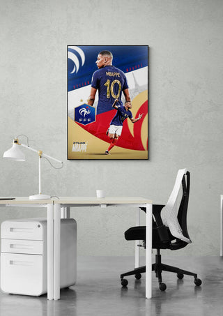 Kylian Mbappé football poster on a wall above a modern office desk and chair setup.