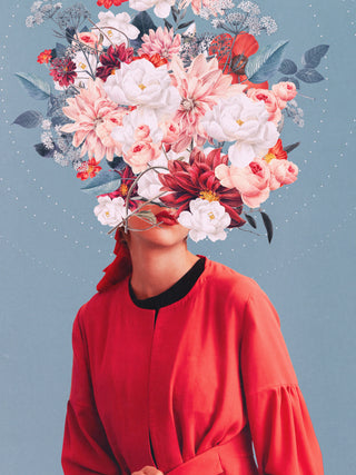 Surreal portrait of a woman in red with her face obscured by a large bouquet of flowers, on a blue background.