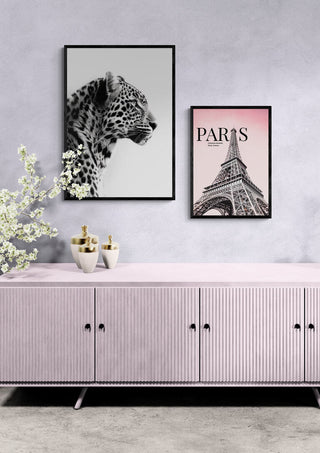 Framed Paris Eiffel Tower Pink art print on wall above pastel sideboard, styled with modern decor.